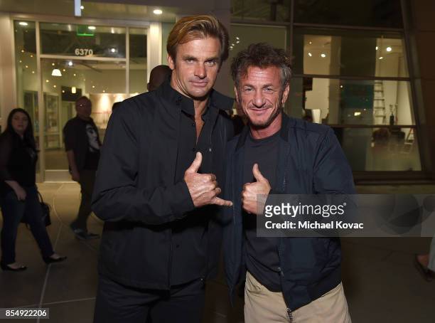 Laird Hamilton and Sean Penn attend the Los Angeles premiere of 'Take Every Wave' at ArcLight Cinemas on September 27, 2017 in Hollywood, California.