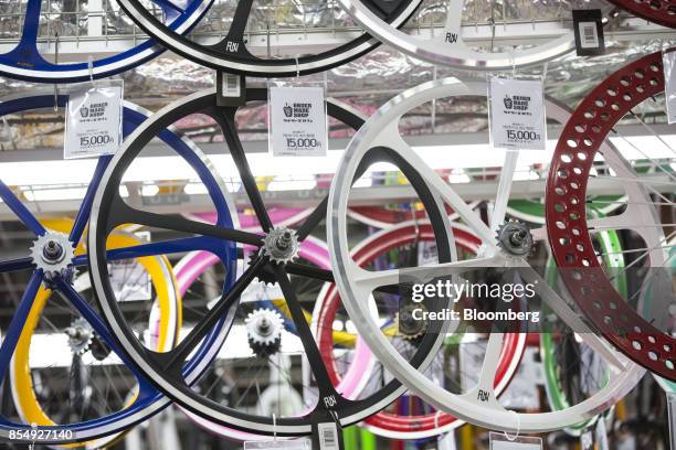 Bicycle wheels are displayed for sale at the Bic Camera Keio Chofu store, operated by Bic Camera Inc., inside the Trie Keio Chofu Shopping Center in...