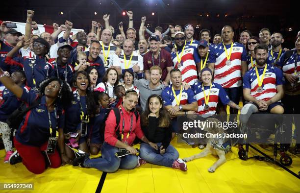 Prince Harry poses for a photograph with the UK Armed Forces Team, Georgian Team and USA Team after the Sitting Volleyball Finals during the Invictus...