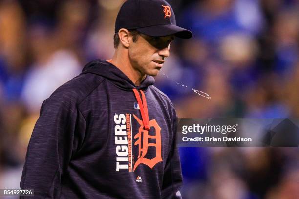 Brad Ausmus of the Detroit Tigers spits during the seventh inning against the Kansas City Royals at Kauffman Stadium on September 27, 2017 in Kansas...