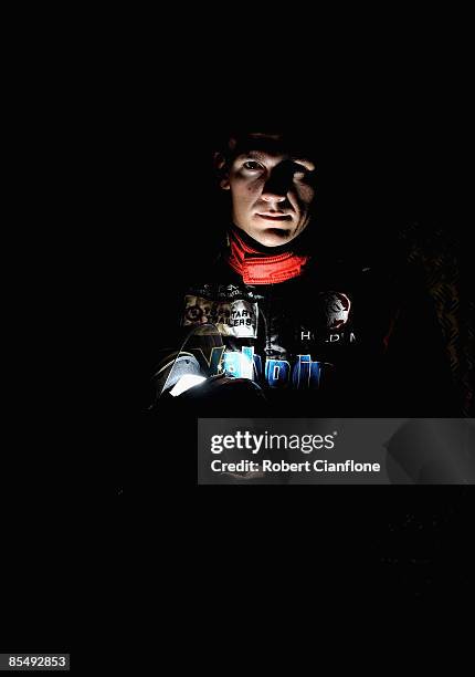 Lee Holdsworth driver of the Garry Rogers Motorsport Holden poses for a portrait in the pit garages in preperation for the Clipsal 500, round one of...