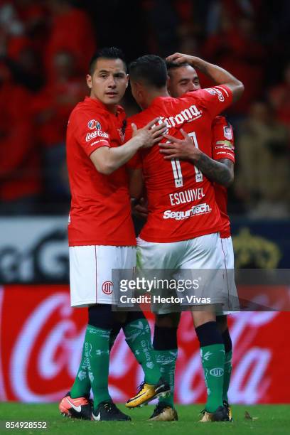 Players of Toluca celebrate after an own goal scored by Luis Quintana of Pumas during the 11th round match between Toluca and Pumas UNAM as part of...