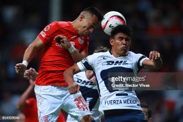 Fernando Uribe of Toluca struggles for the ball with Jesus Gallardo of Pumas during the 11th round match between Toluca and Pumas UNAM as part of the...