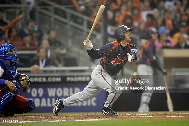 Michihiro Ogasawara of Japan drives home two runs as he reaches on a fielding error by Cuban center fielder Yoennis Cespedes the 2009 World Baseball...