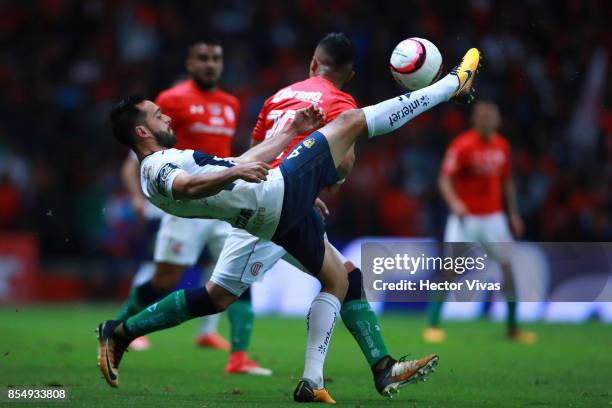 Fernando Uribe of Toluca struggles for the ball with Luis Quintana of Pumas during the 11th round match between Toluca and Pumas UNAM as part of the...