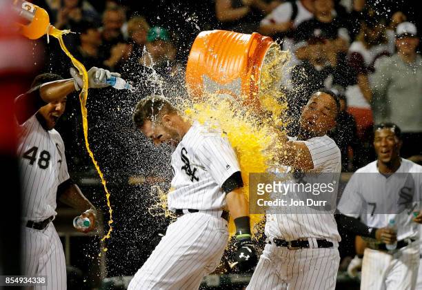 Jose Abreu of the Chicago White Sox and Rymer Liriano dunks Nicky Delmonico after he hit a walkoff two run home run against the Los Angeles Angels of...