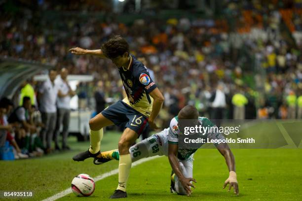 Carlos Orrantia of America fights for the ball with Andres Mosquera of Leon during the 11th round match between Leon and America as part of the...