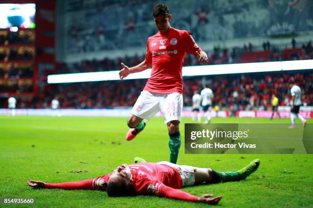 Rodrigo Salinas and Pablo Barrientos of Toluca celebrate the second goal of their team during the 11th round match between Toluca and Pumas UNAM as...