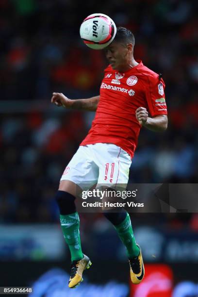 Carlos Esquivel of Toluca heads the ball during the 11th round match between Toluca and Pumas UNAM as part of the Torneo Apertura 2017 Liga MX at...