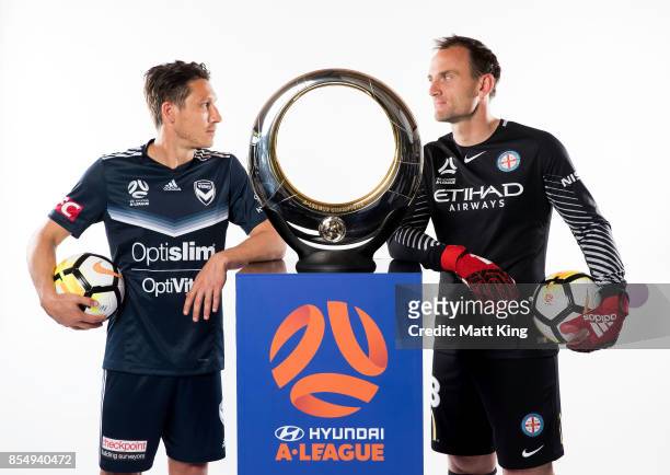 Mark Milligan of the Melbourne Victory and Eugene Galekovic of Melbourne City FC pose during the A-League Media Day on September 26, 2017 in Sydney,...