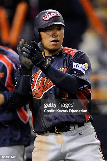 Akinori Iwamura of Japan claps his hands after scoring against Cuba during the 2009 World Baseball Classic Round 2 Pool 1 Game 5 on March 18, 2009 at...