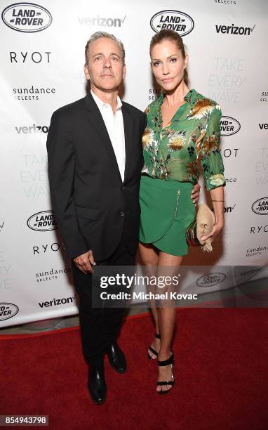 Producer Jonathan S. Marshall and actress Tricia Helfer attend the Los Angeles premiere of 'Take Every Wave: The Life of Laird Hamilton,' sponsored...