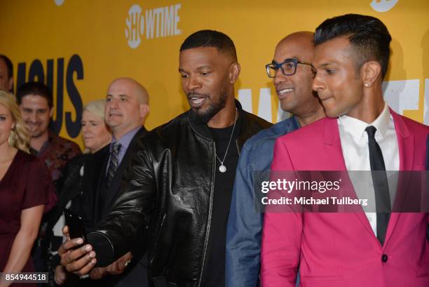 Executive Producers Jamie Foxx and Tim Story and actor Utkarsh Ambudkar take a selfie at the premiere of Showtime's "White Famous" at The Jeremy...