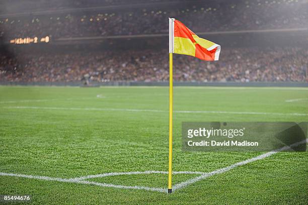 corner flag on soccer field with spectators. - corner marking stockfoto's en -beelden
