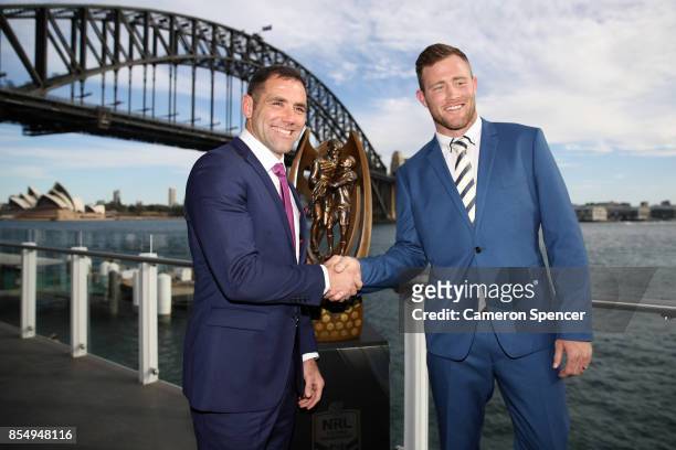 Melbourne Storm captain Cameron Smith and North Queensland Cowboys captain Gavin Cooper pose with the Provan Summons trophy during the NRL Grand...