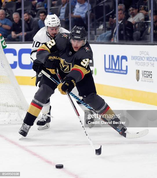 Tomas Nosek of the Vegas Golden Knights looks to control the puck under pressure from Andrei Loktionov of the Los Angeles Kings during a preseason...