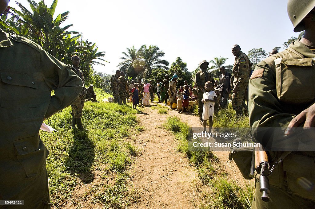 Rwandan Defense Forces and the Congolese military , wearing green ...