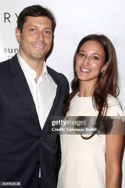 Tim Greenberg and Cristina Rodriguez attend the Premiere of Sundance Selects' "Take Every Wave: The Life Of Laird Hamilton" at ArcLight Hollywood on...