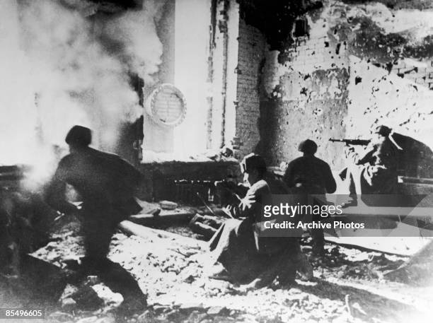 Russian soldiers target the Germans from within an abandoned building during the Battle of Stalingrad, World War II, circa 1942. The soldier in...