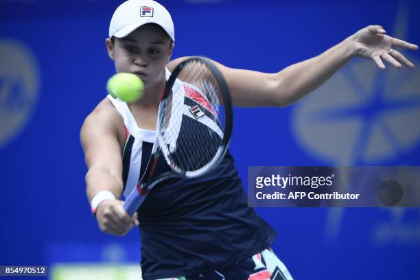 Ashleigh Barty of Australia hits a return against Karolina Pliskova of Czech Repubic during the women's singles quarter-final match at the WTA Wuhan...