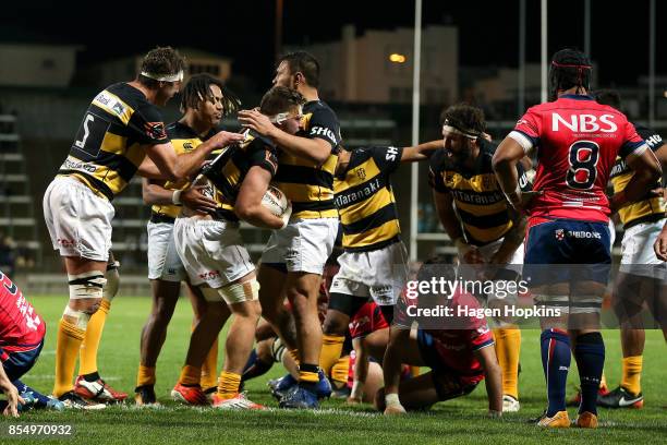 Lachlan Boshier of Taranaki is congratulated after scoring a try during the round seven Mitre 10 Cup match between Taranaki and Tasman at Yarrow...