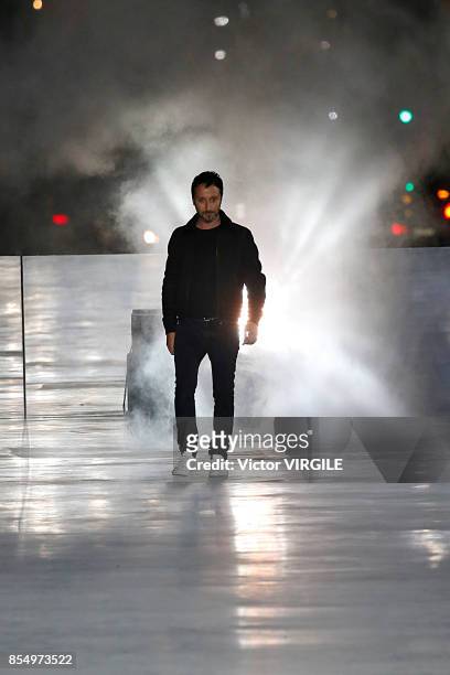 Fashion designer Anthony Vaccarello walks the runway during the Saint Laurent Ready to Wear Spring/Summer 2018 fashion show as part of the Paris...