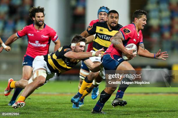 Trael Joass of Tasman is tackled by Lachlan Boshier of Taranaki during the round seven Mitre 10 Cup match between Taranaki and Tasman at Yarrow...