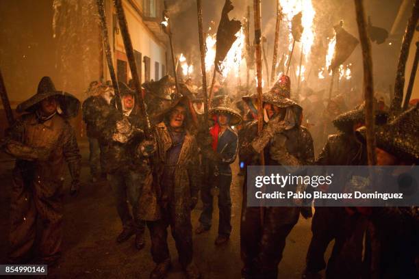 Villagers hold torches made of wine skins during El Vitor Civic procession on September 27, 2017 in Mayorga, Valladolid province, Spain. Every 27 of...