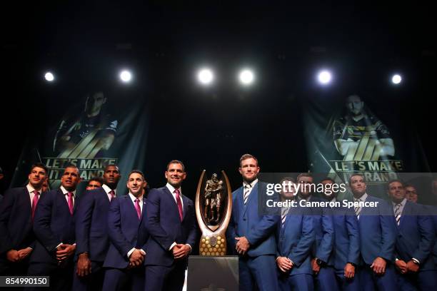 North Queensland Cowboys captain Gavin Cooper, Melbourne Storm captain Cameron Smith and their team mates are introduced during the NRL Fan Day at...