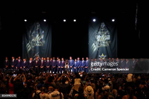 North Queensland Cowboys captain Gavin Cooper, Melbourne Storm captain Cameron Smith and their team mates are introduced during the NRL Fan Day at...