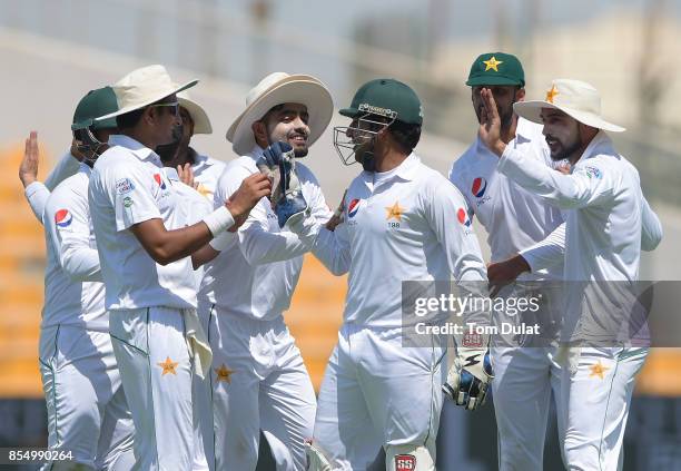 Captain of Pakistan, Sarfraz Ahmed celebrates taking the wicket of Kusal Mendis of Sri Lanka during Day One of the First Test between Pakistan and...