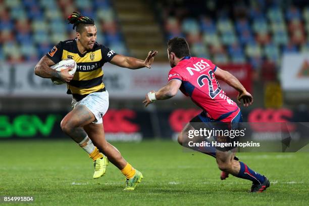 Sean Wainui of Taranaki fends Timothy O'Malley of Tasman during the round seven Mitre 10 Cup match between Taranaki and Tasman at Yarrow Stadium on...