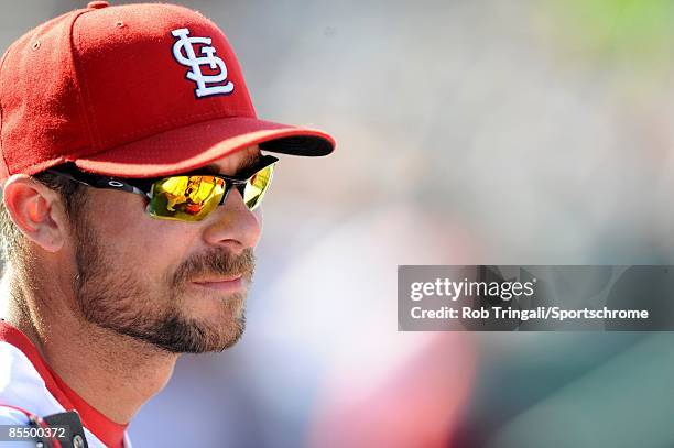Rick Ankiel of the St. Louis Cardinals looks on against the Washington Nationals during a spring training game at Roger Dean Stadium on February 28,...