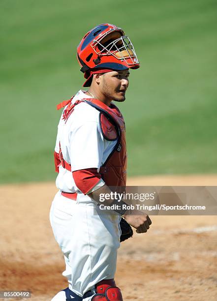 Yadier Molina of the St. Louis Cardinals looks on against the Washington Nationals during a spring training game at Roger Dean Stadium on February...