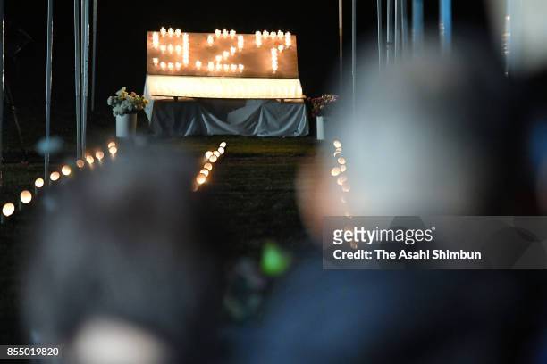 Bereaved family members commemorate victims at Taiyo-no-Oka Park on September 27, 2017 in Kiso, Nagano, Japan. Candles are lit to honour the 63...