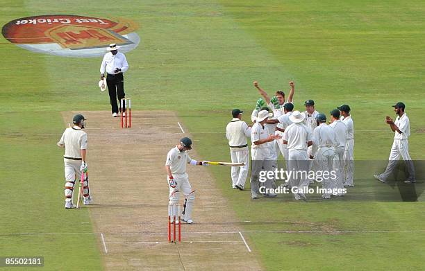Brad Haddin of Australia is bowled lbw by Paul Harris for 42 after a review to 3rd umpire, during day one of the Third Test between South Africa and...