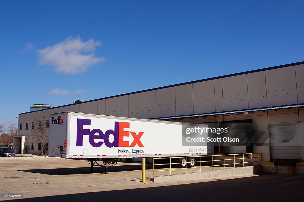 A FedEx trailer sits at a loading dock at one of the company's... News