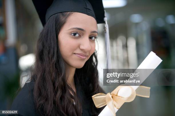 young girl in a graduation gown. - college girl profile stock pictures, royalty-free photos & images