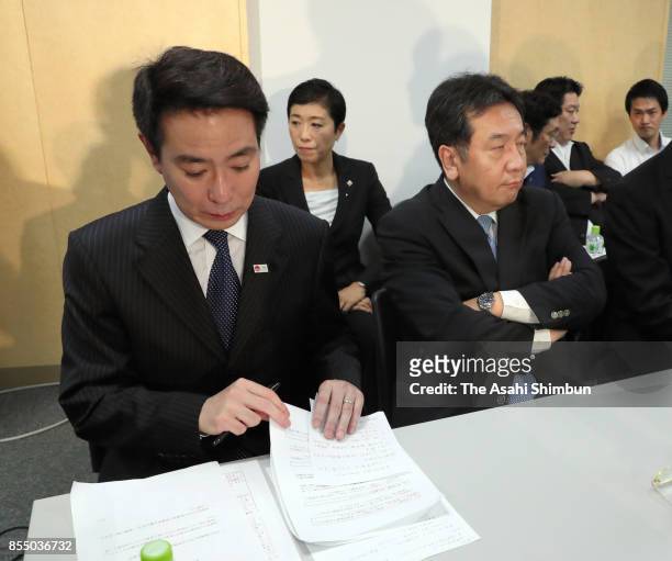 Opposition Democratic Party President Seiji Maehara and Deputy President Yukio Edano attend the party's lawmakers meeting at the party headquarters...