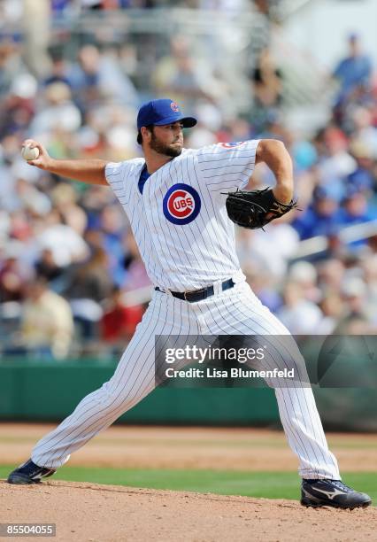 Justin Berg of the Chicago Cubs pitches during a Spring Training game against the Los Angeles Dodgers at HoHoKam Park on March 6, 2009 in Mesa,...