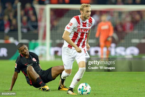 Gelson Fernandes of Frankfurt and Marcel Risse of Koeln battle for the ball during the Bundesliga match between 1. FC Koeln and Eintracht Frankfurt...