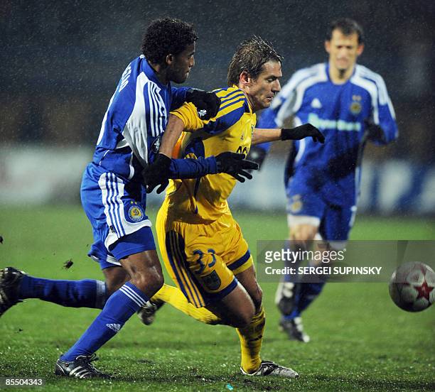 Marko Devic of Ukrainian football club Metalist Kharkov fights for the ball with Betao of Dynamo Kiev during their UEFA Cup football match, round 16,...