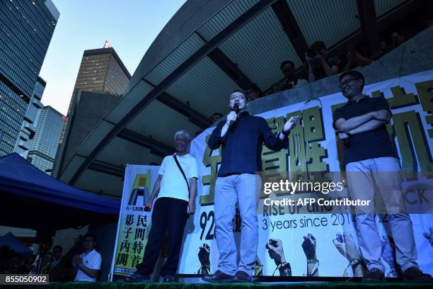 Law professor and one of the leaders of the 2014 Occupy protests Benny Tai speaks as reverend Chiu Yu Ming and Chan Kin-Man listen during a gathering...