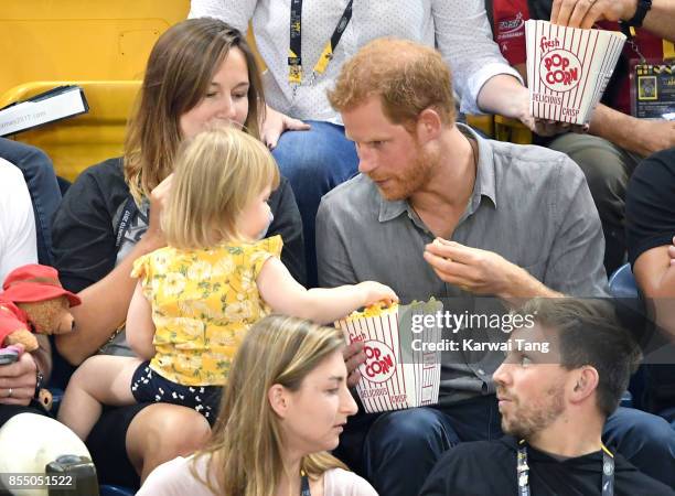 Prince Harry with Hayley Henson, wife of British Paralympian Dave Henson and their two-year-old daughter Emily attend the Seated Volleyball on day 5...