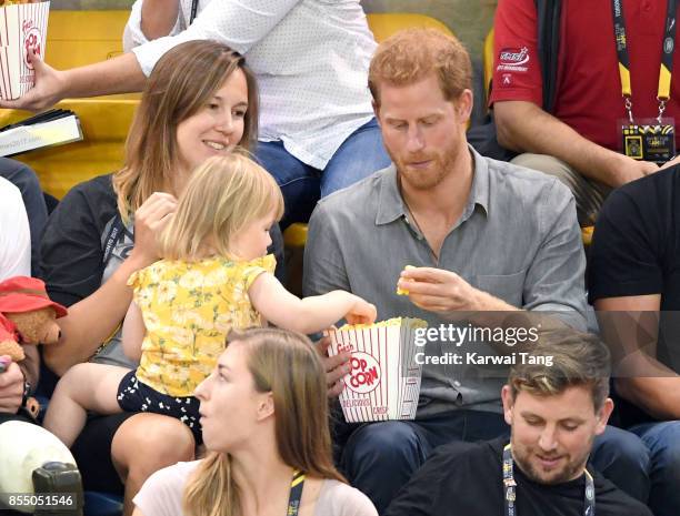 Prince Harry with Hayley Henson, wife of British Paralympian Dave Henson and their two-year-old daughter Emily attend the Seated Volleyball on day 5...