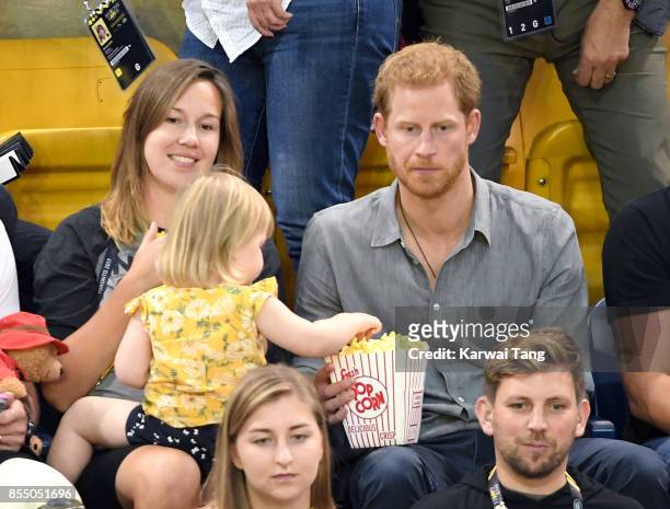 Prince Harry with Hayley Henson, wife of British Paralympian Dave Henson and their two-year-old daughter Emily attend the Seated Volleyball on day 5...