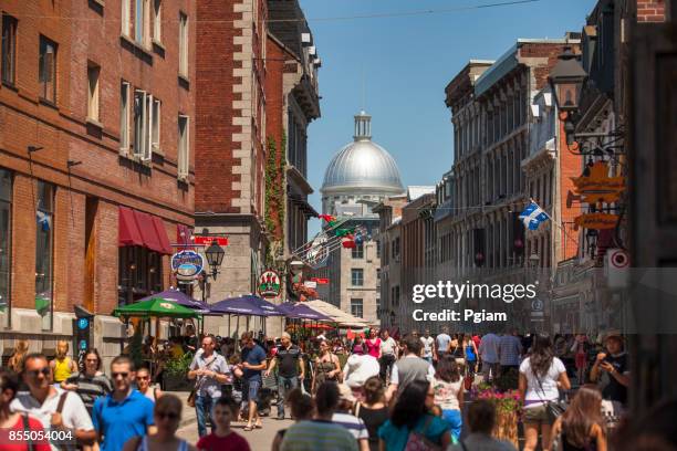 busy street in old montreal quebec canada - bonsecours market stock pictures, royalty-free photos & images
