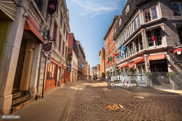 cobblestone streets in old montreal quebec canada - montreal street stock pictures, royalty-free photos & images