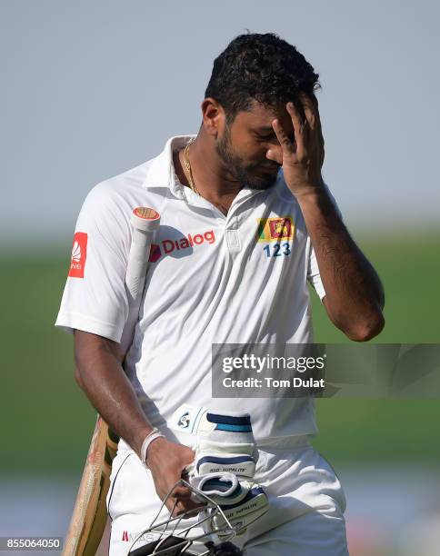 Dimuth Karunaratne of Sri Lanka leaves looks dejected after being dismissed during Day One of the First Test between Pakistan and Sri Lanka at Sheikh...