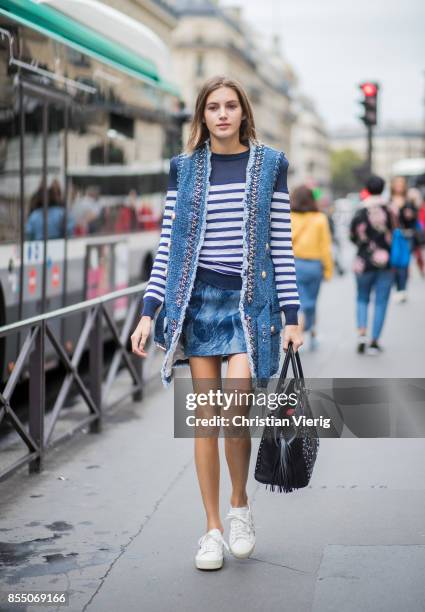 Model Valery Kaufman wearing a striped knit vest is seen outside Balmain during Paris Fashion Week Spring/Summer 2018 on September 28, 2017 in Paris,...